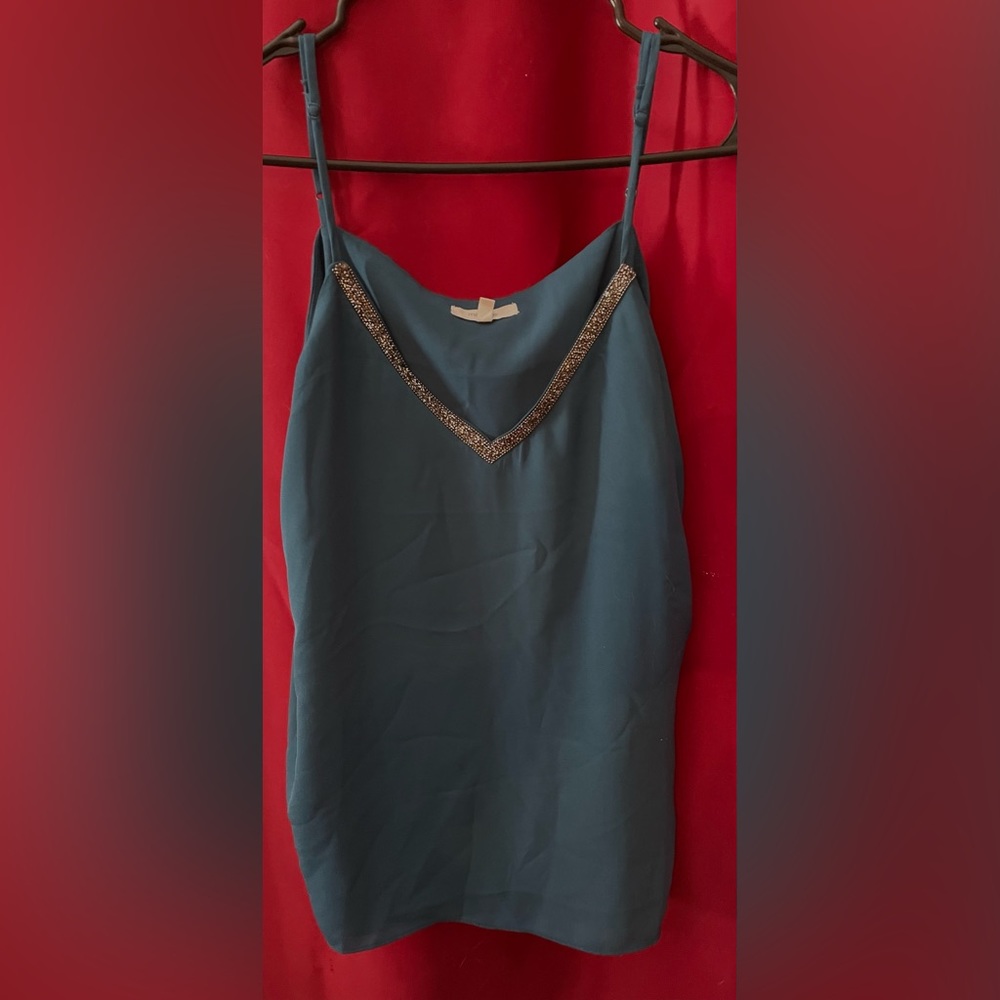 Maurice’s turquoise tank top